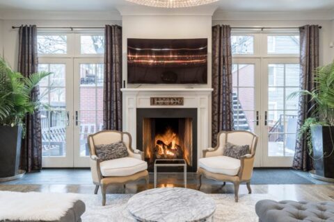 A wood-burning fireplace in living room at Maryland