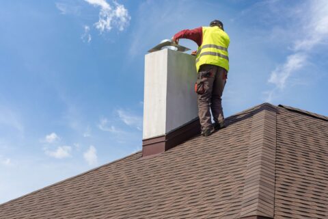 The Chimney Tek staff checking the chimney in rooftop at Glen Burnie, MD