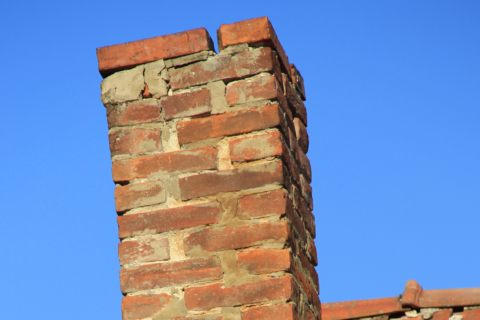 Damaged brick chimney